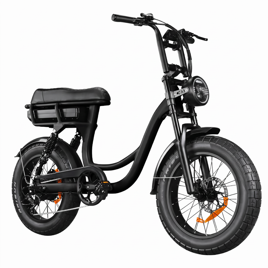 Front three-quarter view of a matte black step-through electric bike with wide fat tires, round LED headlight, and high handlebars